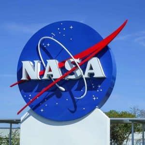 A sign with a logo and a red and white symbol, reminiscent of the sleek design often seen in iPhone ISS visuals.