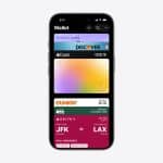 An iPhone screen displays the Apple Wallet app with digital cards, including a driver's license, Discover card, Apple Card, Dunkin’ card, Delta boarding pass, a red event ticket, and an option to access Apple Wallet Expired Passes.