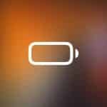 A low battery icon in white appears centered on a blurred orange and brown background, with a small "Apple" logo in a rectangle at the bottom right corner—suggesting you check Activity Monitor for Mac Energy Impact to improve Mac performance.