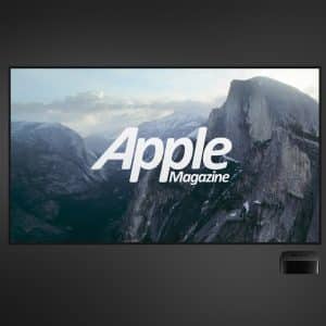 A flat-screen TV displays a mountain landscape with the text "Apple Magazine," resembling Apple TV screensavers. Next to the TV are an Apple TV device and a remote, all set against a dark gradient background.