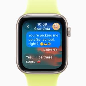 An Apple Watch screen displays Apple Watch Notifications from "Grandma." A child asks, "You’re picking me up after school, right?" with emojis. Grandma replies, "Yes, I’ll be there soon," using a car emoji. The watch band is yellow-green.