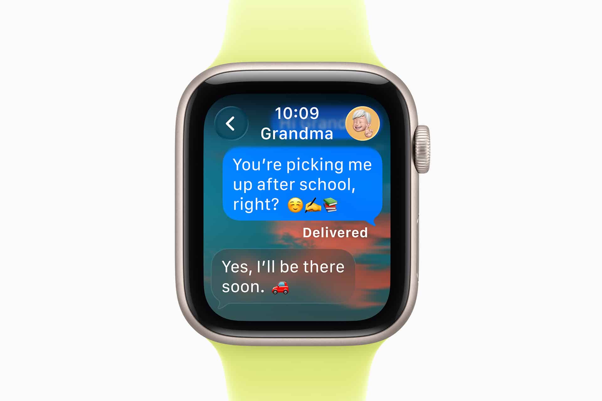 An Apple Watch screen displays Apple Watch Notifications from "Grandma." A child asks, "You’re picking me up after school, right?" with emojis. Grandma replies, "Yes, I’ll be there soon," using a car emoji. The watch band is yellow-green.