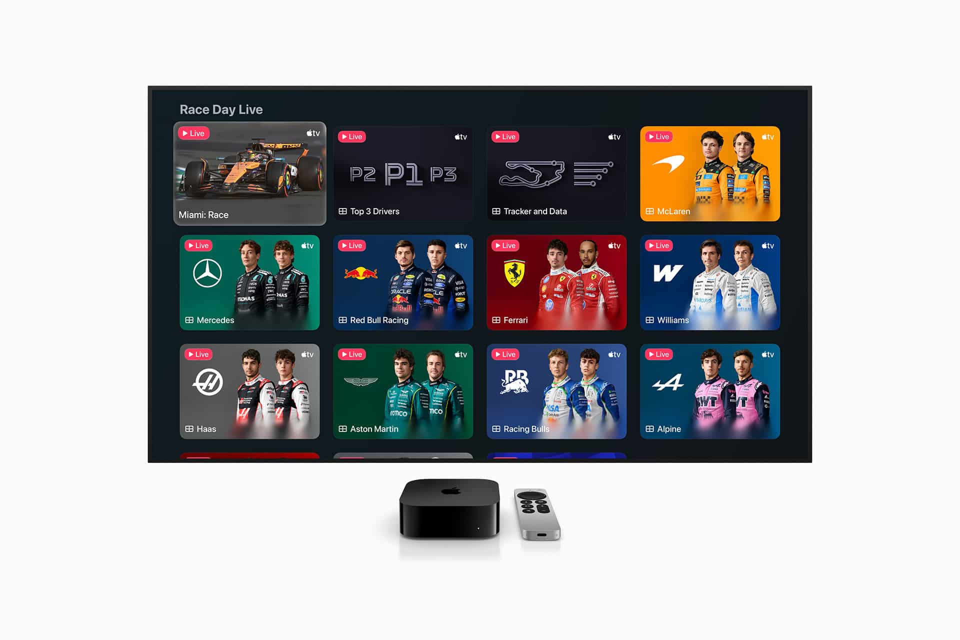 Apple TV F1 - A TV screen displays the Apple TV Formula 1 race app interface with multiple live viewing options, team and driver images, and race data. An Apple TV device and remote are placed in front of the screen.