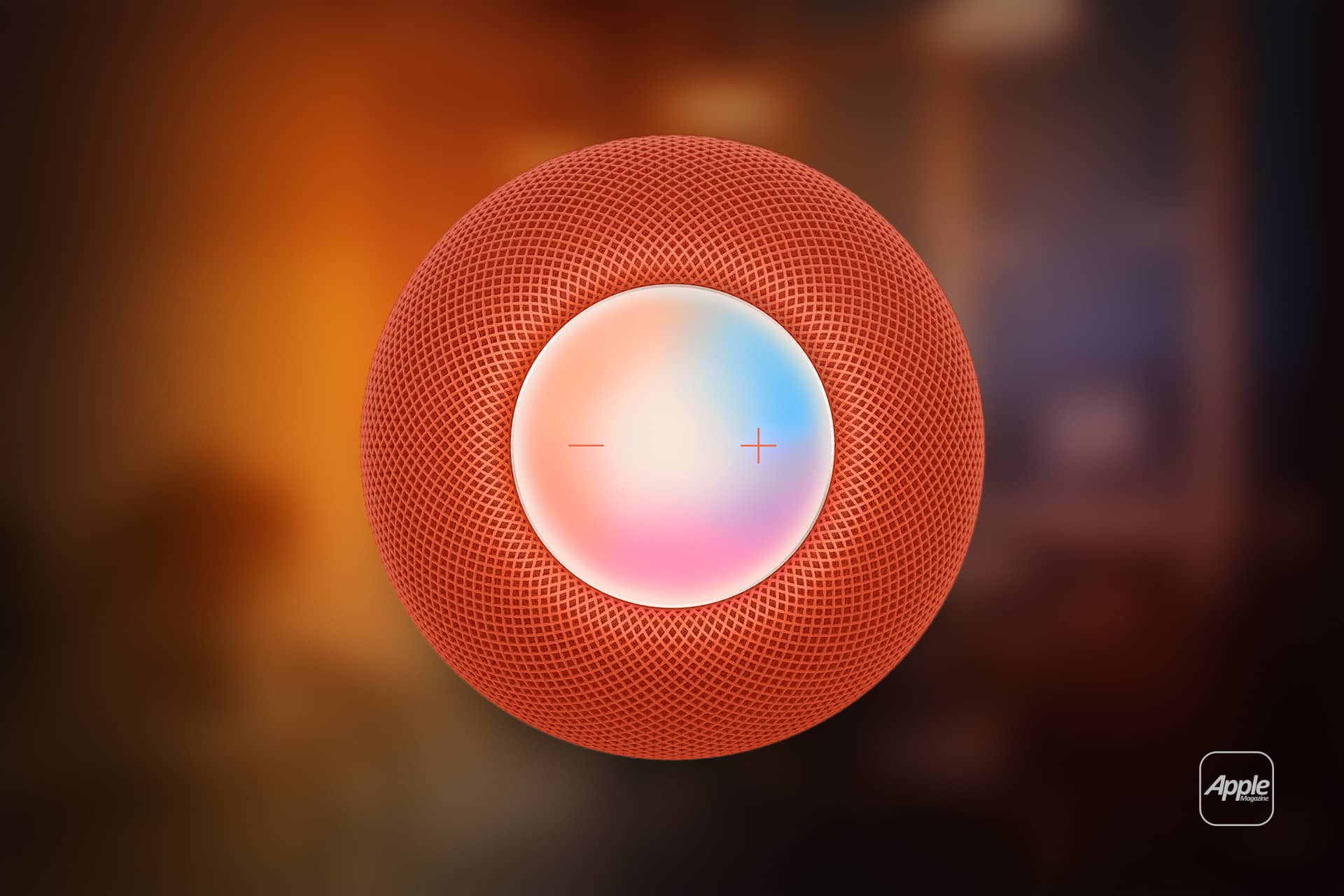 A close-up of a red Apple HomePod Mini smart speaker viewed from above, showing its mesh exterior and touch-sensitive top with minus and plus symbols—perfect for exploring Hidden Siri Commands—set against a blurred background.