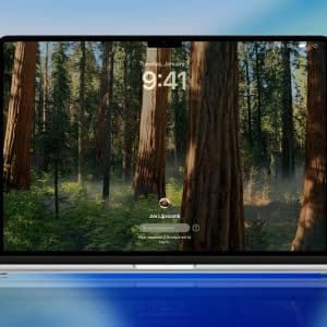 A laptop screen displays a Mac Password Reset login page with a forest background, showing tall trees and greenery. The time reads 9:41, and a profile icon with "Joel Lipccombe" and a password prompt are visible.