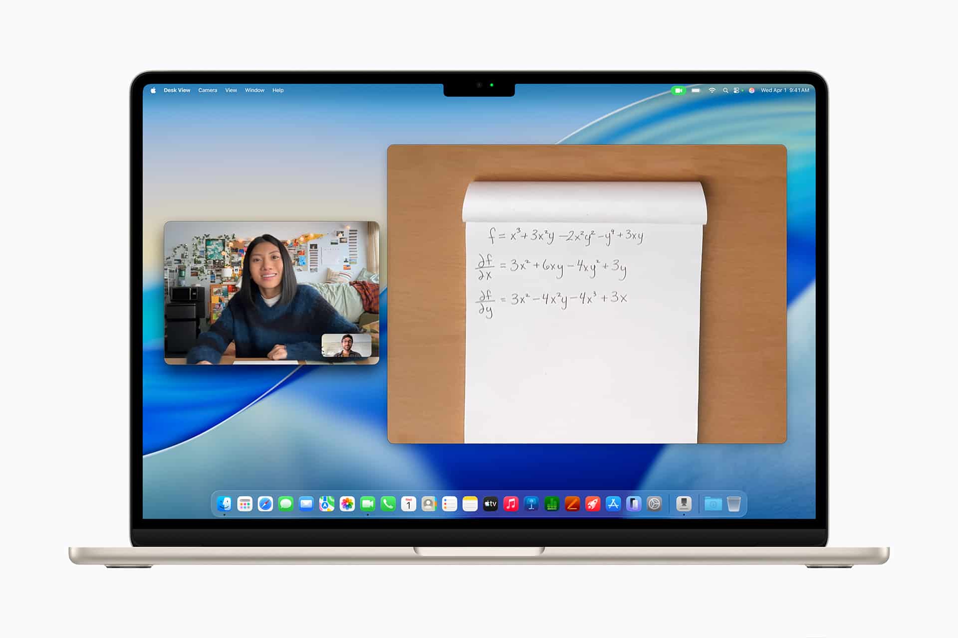 A laptop screen displays a video call with a woman in a small window and a notepad with handwritten math equations in a larger shared view. The desktop shows app icons along the bottom.