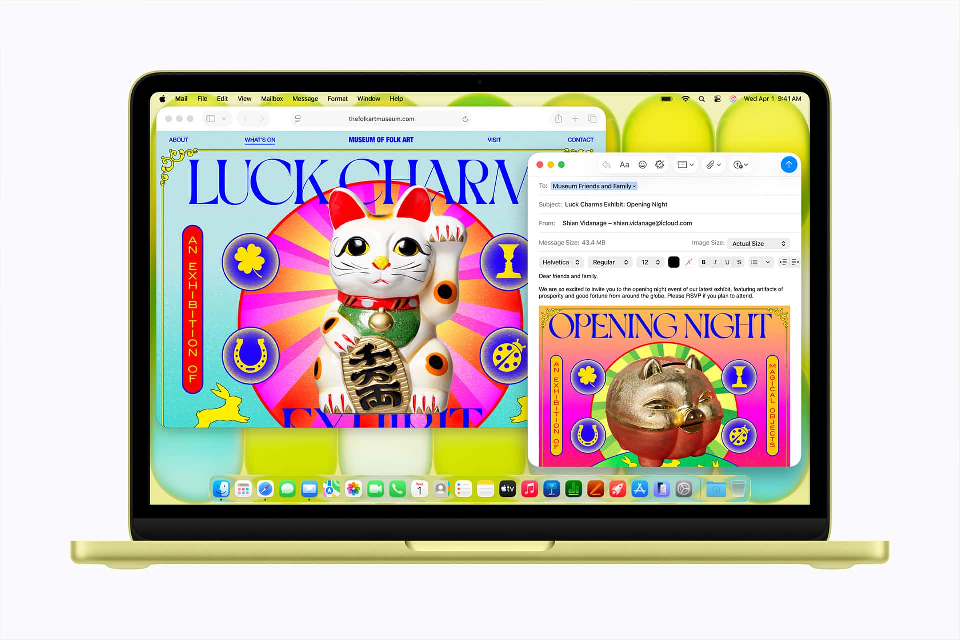 A laptop screen displays a colorful webpage featuring a lucky cat graphic and the text “Luck Charm.” An email window overlaps, showing an invitation with similar vibrant art reading “Opening Night.”.