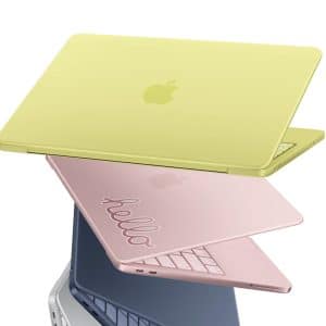 Three Apple MacBook Neo laptops in pastel colors—yellow, pink (with "hello" engraved), and blue—are stacked in a dynamic, angled arrangement against a white background. Perfect for showcasing the latest MacBook Neo sales.