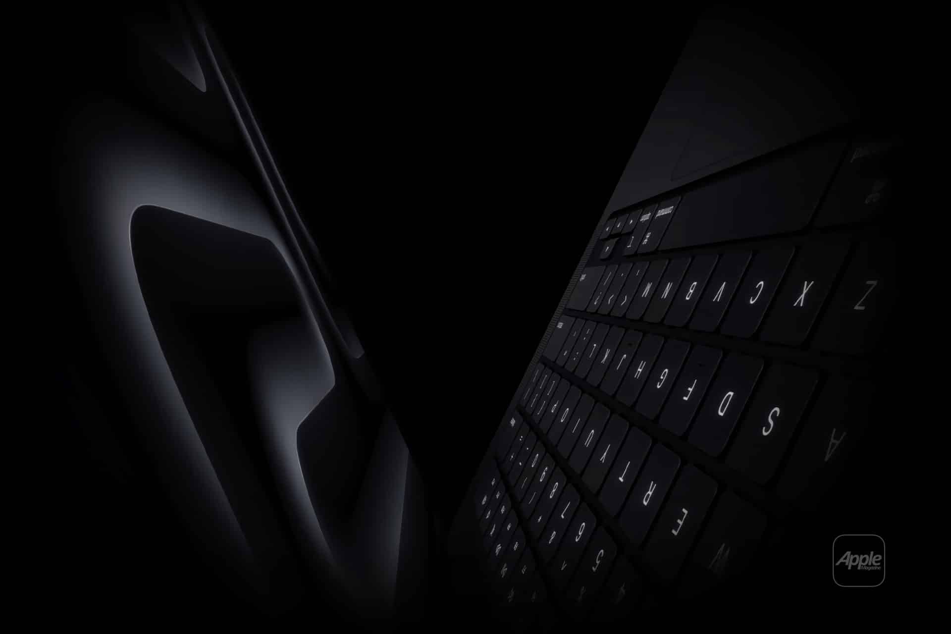 A dark, dramatic close-up of a sleek Apple laptop keyboard and trackpad, with the Apple logo faintly visible in the corner.