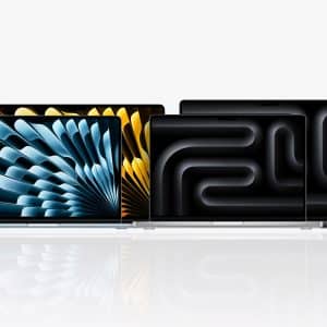 Four Apple MacBook laptops are displayed side by side against a white background, each with colorful abstract designs on their screens. The lineup includes the latest MacBook Pro M5 and MacBook Air M5. An Apple logo appears in the lower right corner.