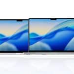 Two Apple MacBook laptops side by side, both showcasing vibrant blue abstract wave wallpapers, highlight the impressive MacBook processing power with the Apple logo clearly visible in the bottom right corner.