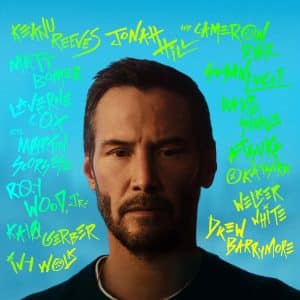 A man with short dark hair and a beard stands against a blue background. Bright neon yellow and green handwritten names, along with the bold words "Outcome Trailer," are scattered around his head in various directions.