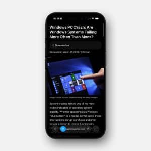A smartphone displays an article titled "Windows PC Crash: Are Windows Systems Failing More Often Than Macs?" in Safari reading mode, featuring a hand pointing at a Windows screen and the Apple logo in the bottom right corner.
