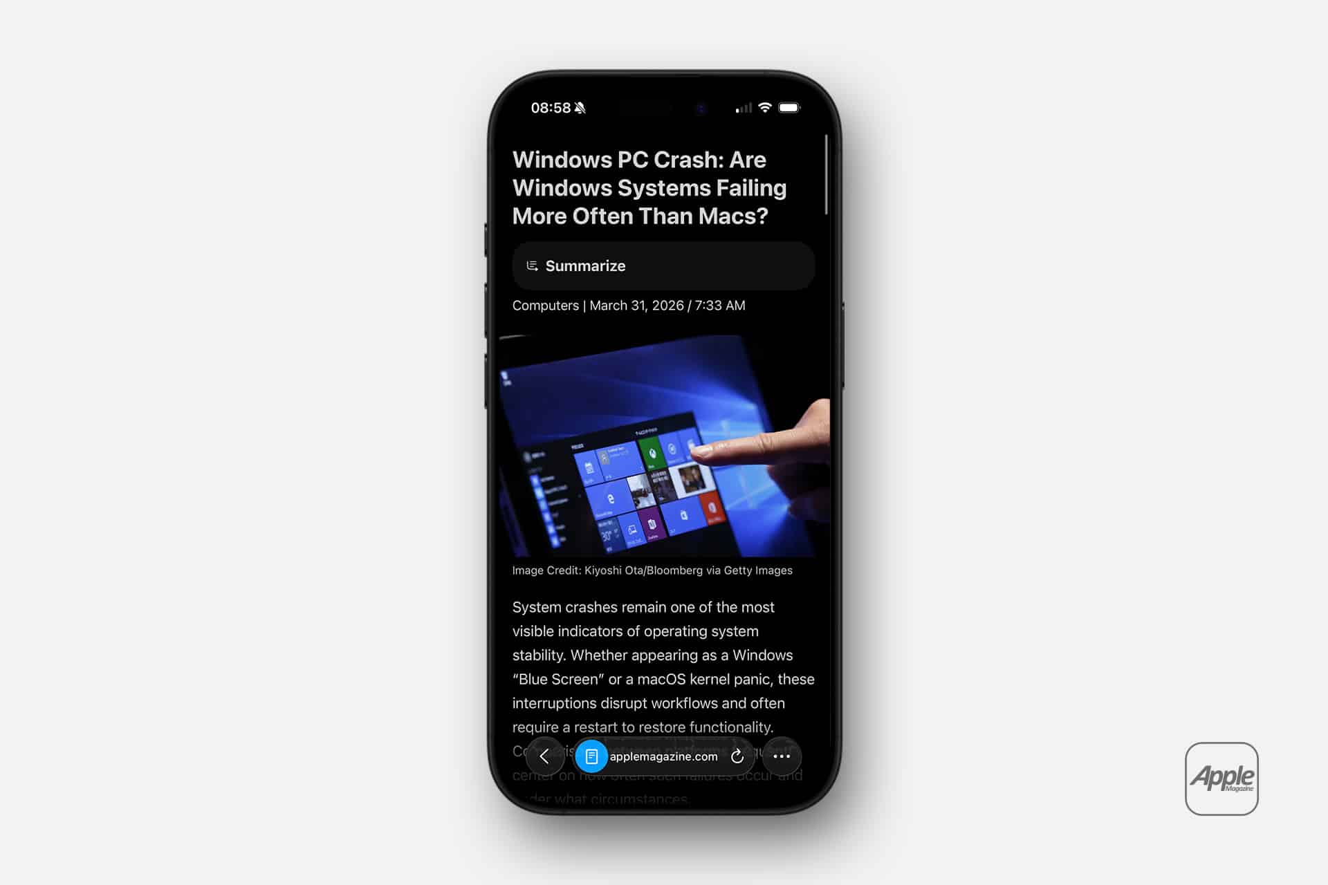 A smartphone displays an article titled "Windows PC Crash: Are Windows Systems Failing More Often Than Macs?" in Safari reading mode, featuring a hand pointing at a Windows screen and the Apple logo in the bottom right corner.
