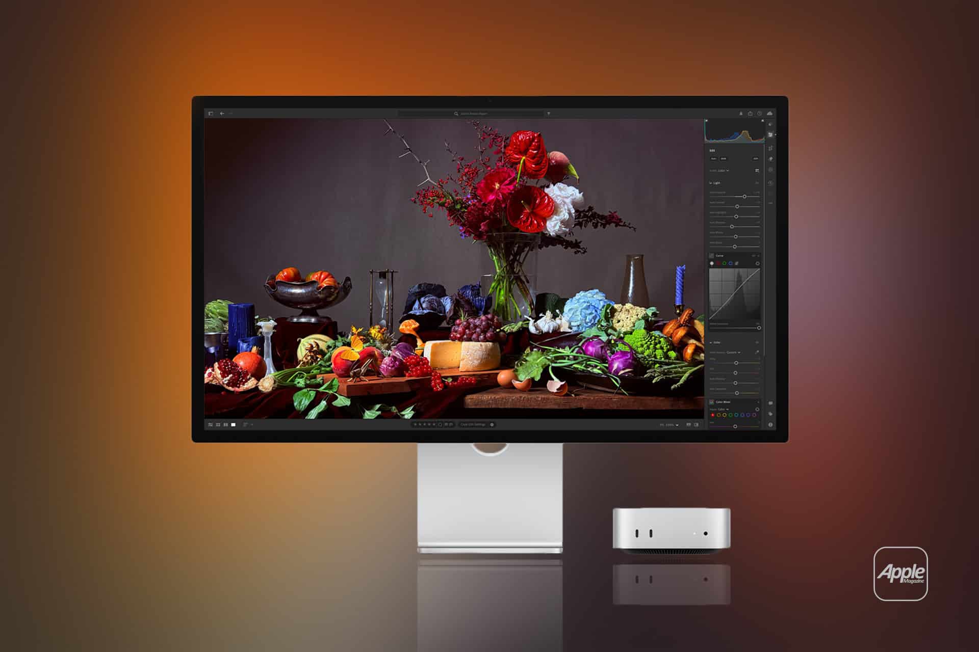 A sleek Apple monitor, tuned with Studio Display XDR settings, displays a vibrant still life of fruits, vegetables, and flowers beside a compact Apple desktop computer, all set against a gradient orange and brown background.