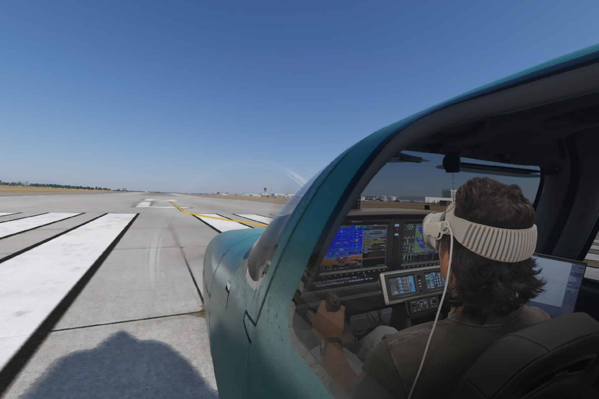 A person wearing a headset sits in the cockpit of a small blue aircraft, taxiing on a runway under a clear blue sky, while X-Plane Vision Pro digital instrument panels glow on the dashboard.