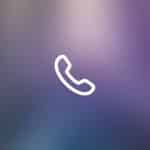 White telephone handset icon centered on a blurred, gradient background with blue, purple, and pink tones. "Apple" and "iPhone Live Voicemail" appear faintly in the bottom right corner.