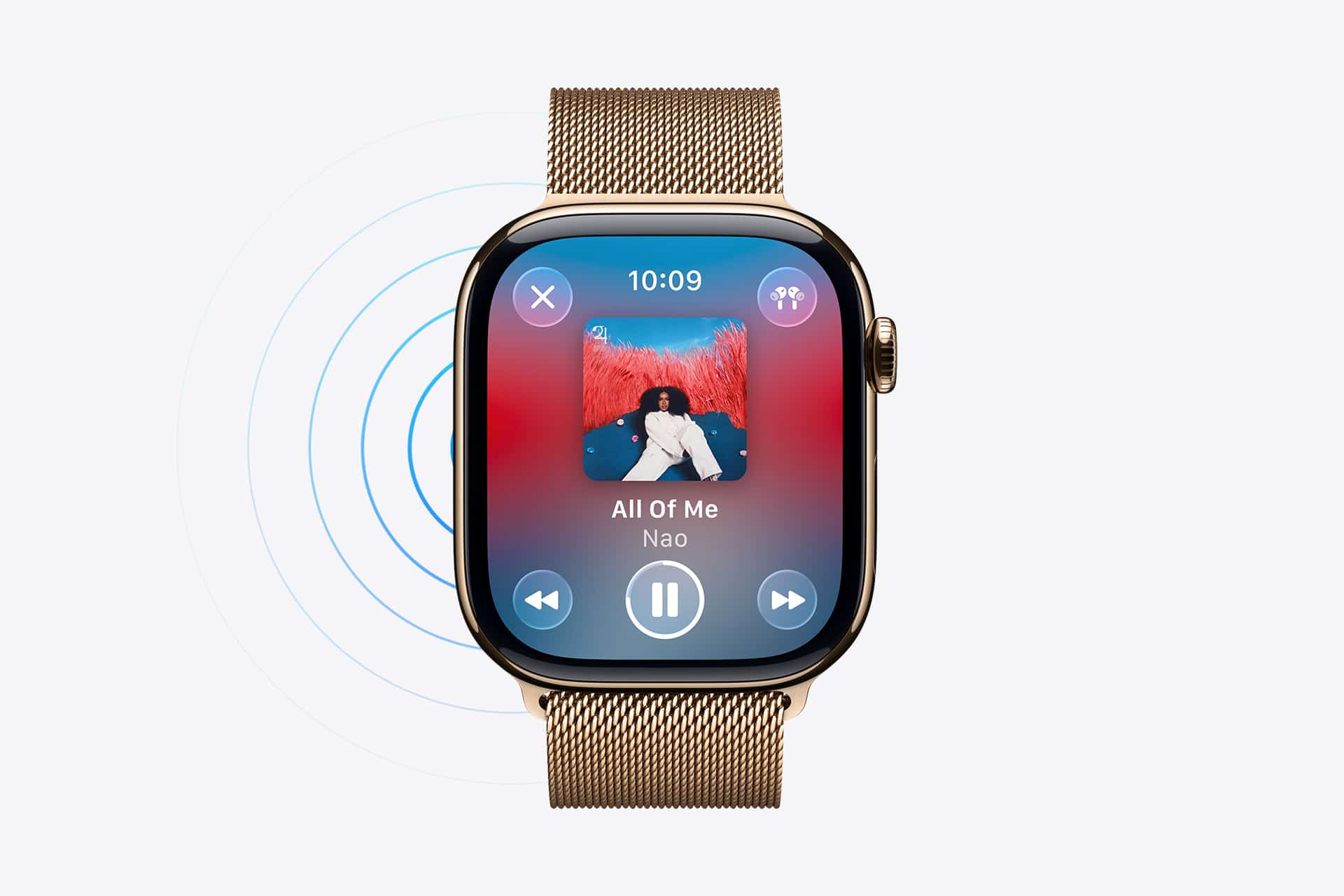 A gold smartwatch with a mesh band displays an Apple Watch Music Sync feature, showing the song "All Of Me" by Nao, album art, play controls, and sound wave graphics on a white background.
