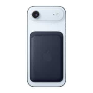 A white iPhone with a dark blue MagSafe Wallet attached to its back, shown against a plain white background. Easily keep track of your essentials with MagSafe Wallet Find.
