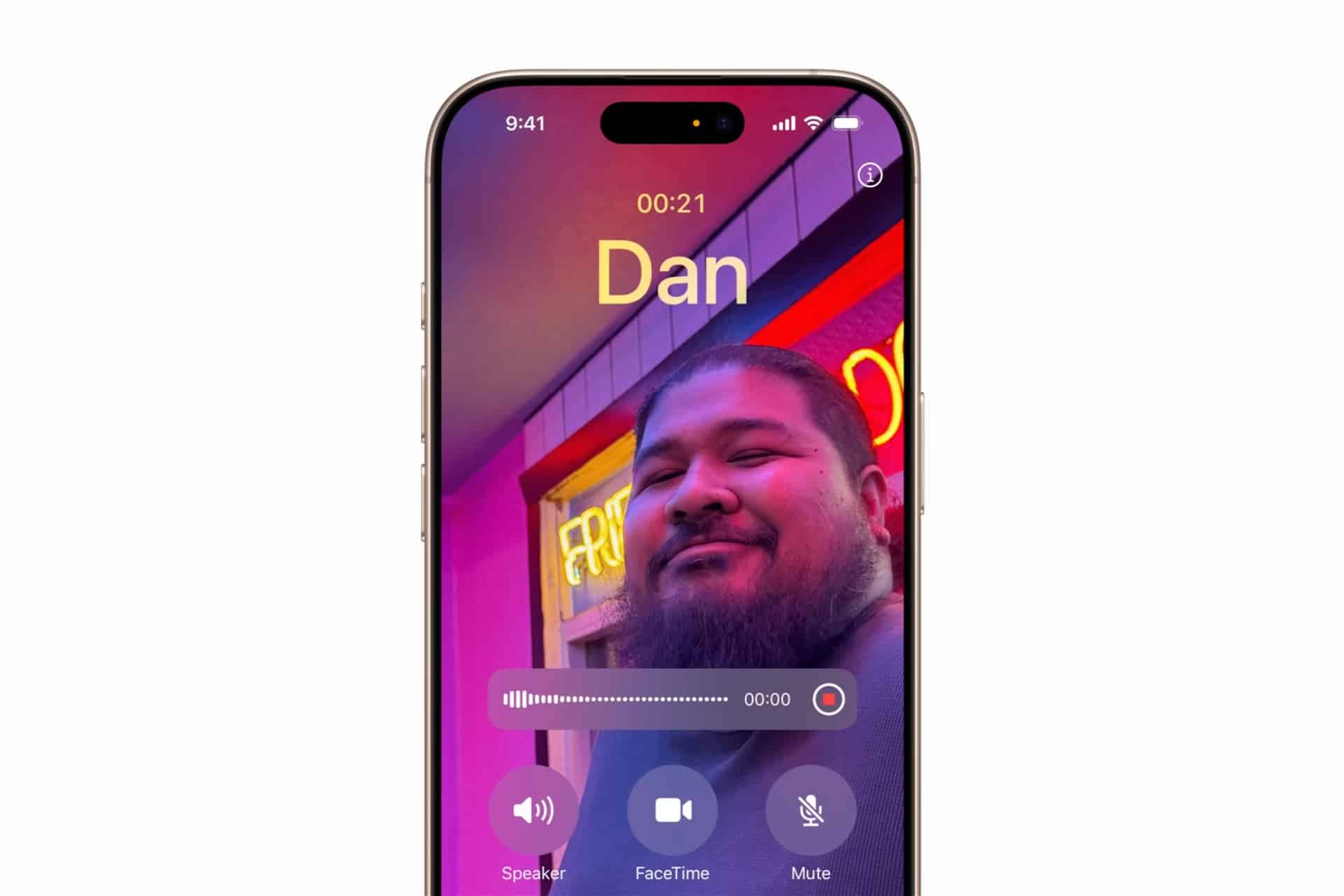 A smartphone screen shows a FaceTime call with a man smiling in front of neon lights, the name “Dan” at the top, call controls at the bottom, and an iPhone Call Recording indicator visible on the display.