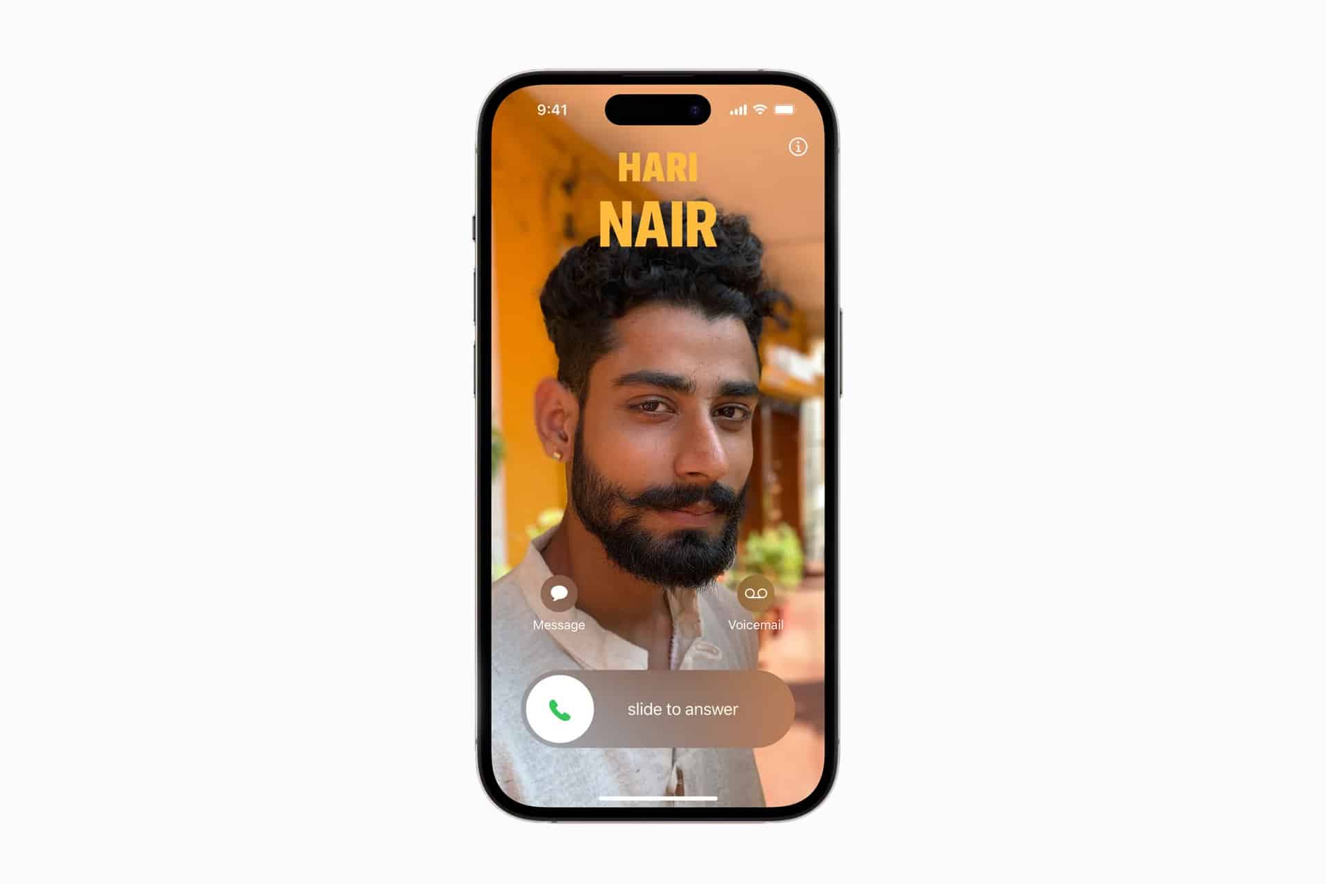 A smartphone screen displays an incoming call from "Hari Nair," featuring a photo of a man with dark hair and beard. Options to message, remind, answer, or initiate iPhone Contact Merge appear at the bottom.