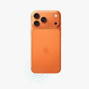 An orange iPhone is shown face down with three camera lenses and the Apple logo visible. Blue concentric circles below the phone suggest wireless charging, while iPhone ringtone custom options elevate your personalization. The Apple logo appears in the bottom right corner.