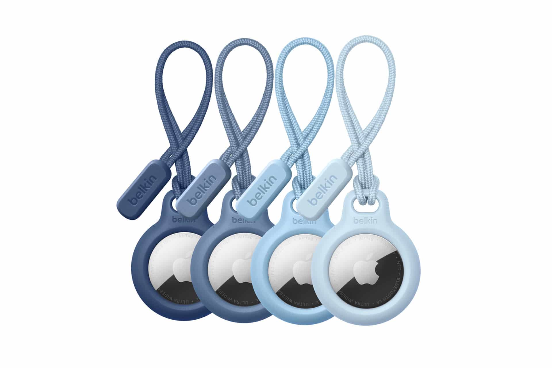 Four Belkin AirTag holders in varying shades of blue are displayed in a row, each holding an Apple AirTag. These AirTag accessory choices feature matching loop straps and Belkin tags against a clean white background.