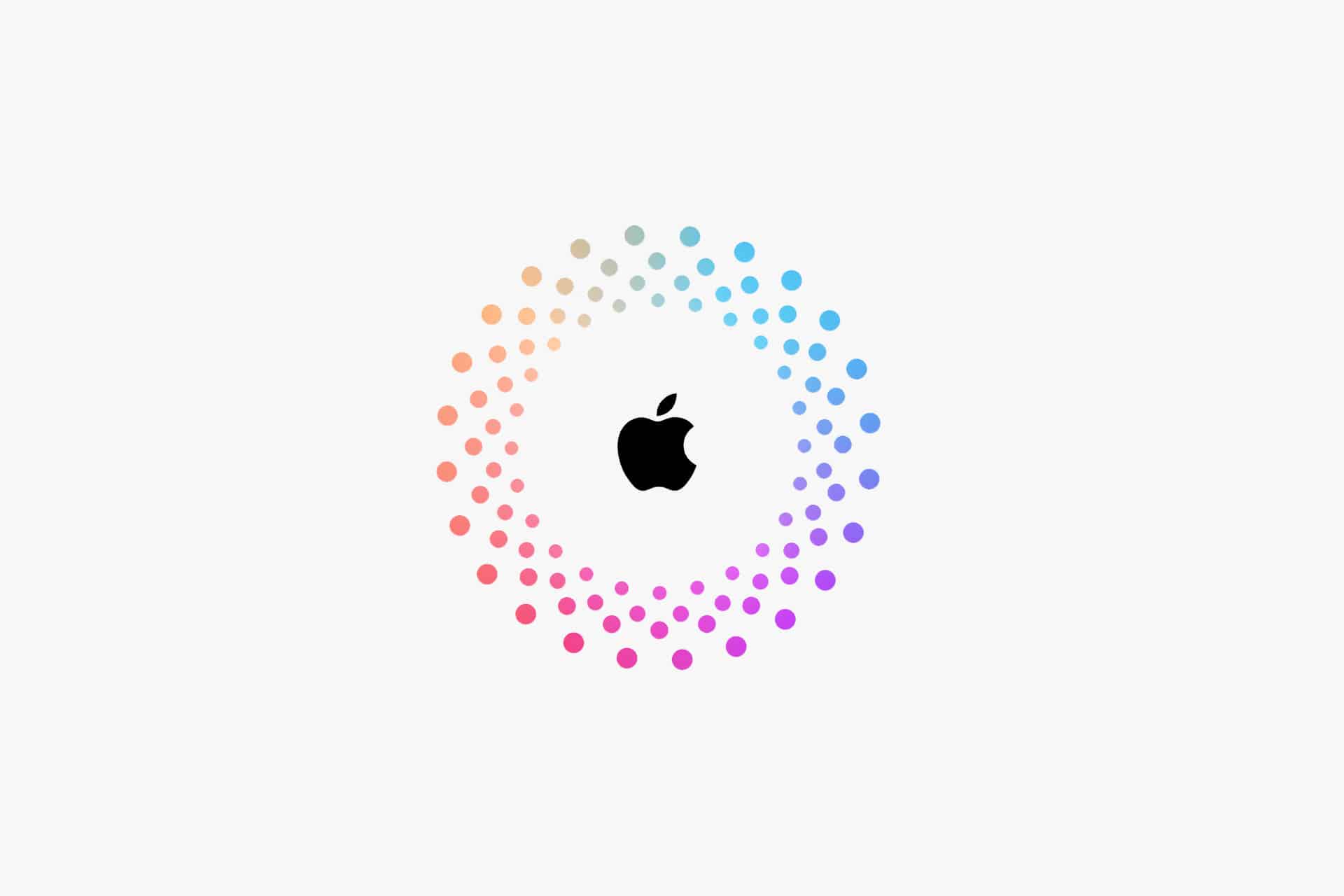 A black Apple logo is centered inside a circle of small, gradient-colored dots transitioning from orange to pink to blue on a white background, often used to warn users about an Apple Account scam.