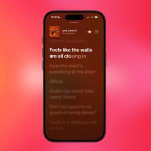 A smartphone screen displays song lyrics from "Lose Control" by Teddy Swims, with the line "Feels like the walls are all closing in" highlighted. The blurred red and pink background hints at Apple Music favorites sync with a small Apple logo in the corner.