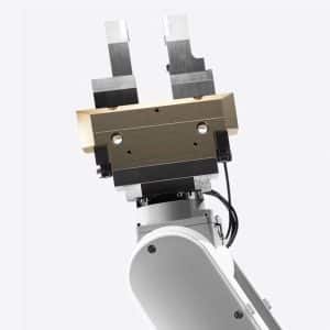 A close-up view of a robotic arm with a metallic gripper, featuring two parallel jaws and exposed mechanical components, similar to those used in the Apple recycling program, set against a plain white background.