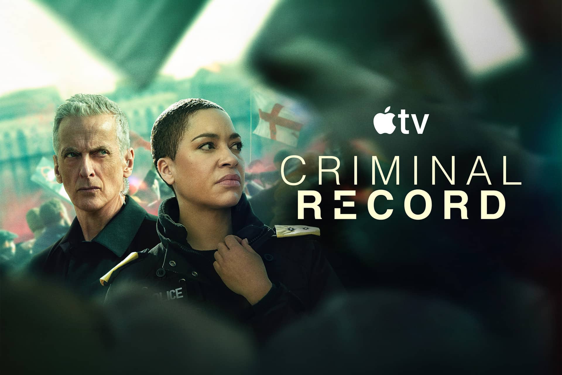 Criminal Record series - Two police officers, a man and a woman, stand side by side looking serious. The Apple TV+ logo and the title "Criminal Record series" appear next to them against a blurred urban background.