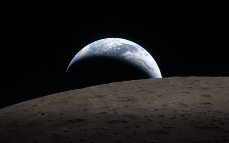 A view of Earth rising above the Moon’s rough, gray surface, a crescent illuminated and most in shadow, set against the blackness of space—captured with detail as sharp as Apple GPU memory enables.