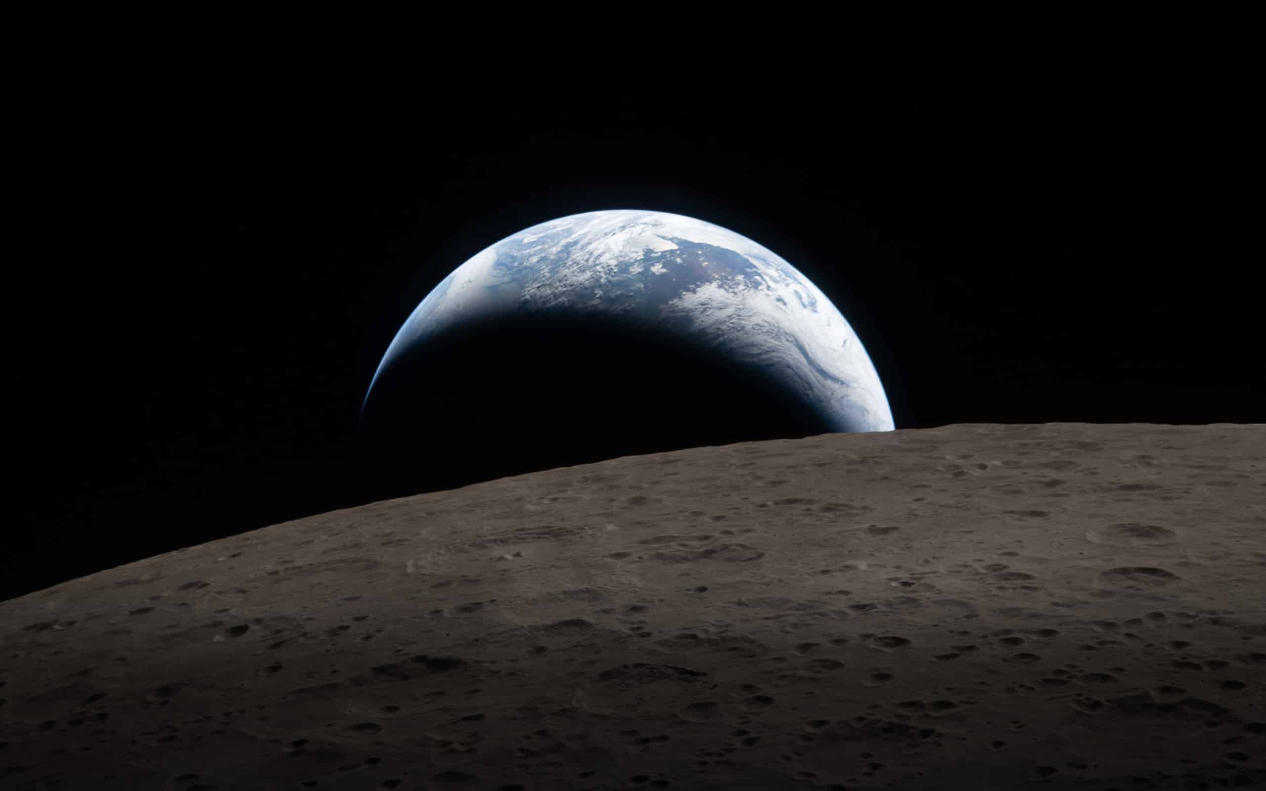 A view of Earth rising above the Moon’s rough, gray surface, a crescent illuminated and most in shadow, set against the blackness of space—captured with detail as sharp as Apple GPU memory enables.