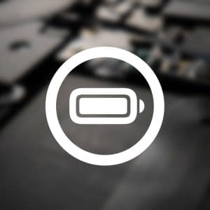 A white battery icon inside a circle is centered over a blurred close-up of electronic components, subtly highlighting Apple battery innovation, with a faint Apple logo in the lower right corner.