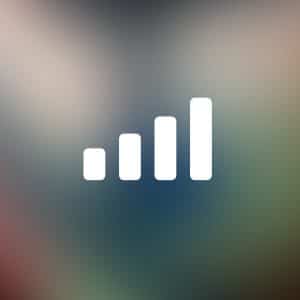 White four-bar signal strength icon centered on a blurred, multicolored background, evoking iPhone mobile data connectivity, with a small Apple logo and the word "Apple" in a rounded box at the bottom right corner.