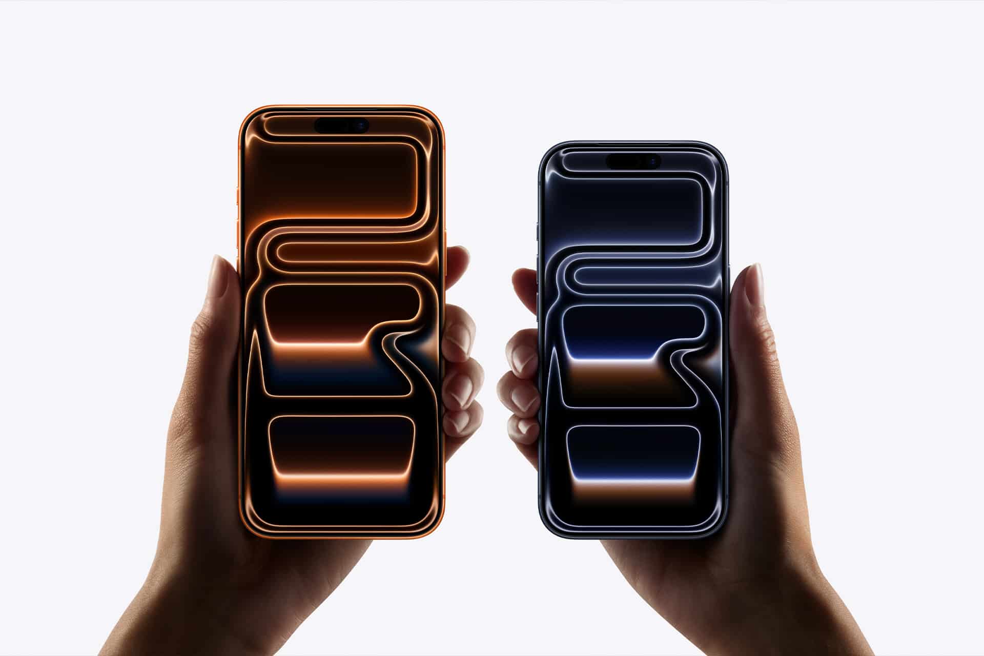 Two hands hold smartphones side by side. The left phone displays orange glowing lines on a black screen, while the right shows blue glowing lines. Both feature sleek designs and smooth visuals, thanks to advanced ProMotion scaling technology.