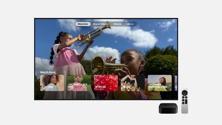 A TV displays a photo memories interface with children playing trumpets, with an Apple TV device and remote shown beside it.