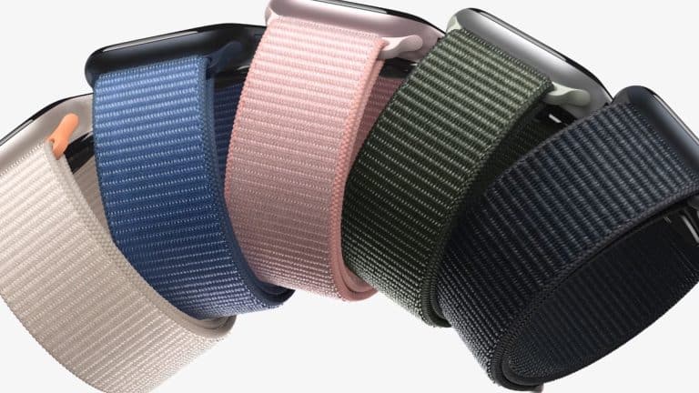 Five smartwatches with woven nylon bands—perfect Apple accessories—in beige, blue, pink, green, and black are arranged in a row against a white background.