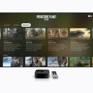 A TV screen displays “Prehistoric Planet: Ice Age” Season 3 on Apple TV, with an Apple TV device and remote in front on a white surface, showcasing Apple accessibility features for an inclusive viewing experience.