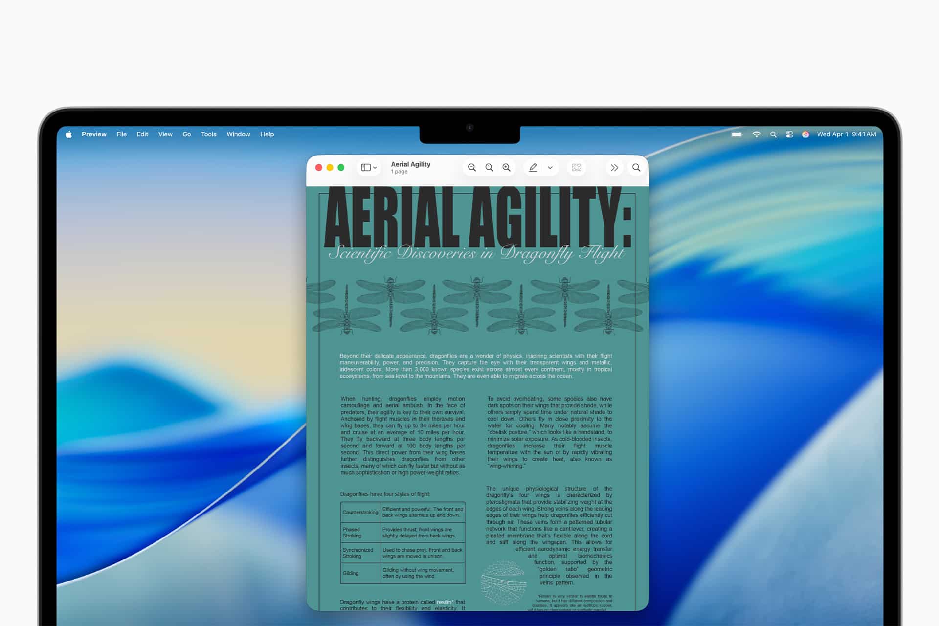A laptop screen displays a teal-colored digital document titled "AERIAL AGILITY: Scientific Discoveries in Dragonfly Flight," featuring text, illustrations, and a comparison chart against a blue abstract background, highlighting Accessibility features.