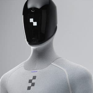 A humanoid robot with a sleek black faceplate and textured light gray body, featuring a geometric logo on its chest and minimalist, futuristic design—an embodiment of Apple robotics and physical AI innovation.