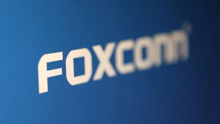 White text reading "FOXCONN" on a blue background, featuring a bold, modern font with slightly blurred edges—an eye-catching design reminiscent of headlines surrounding the recent Foxconn cyberattack.