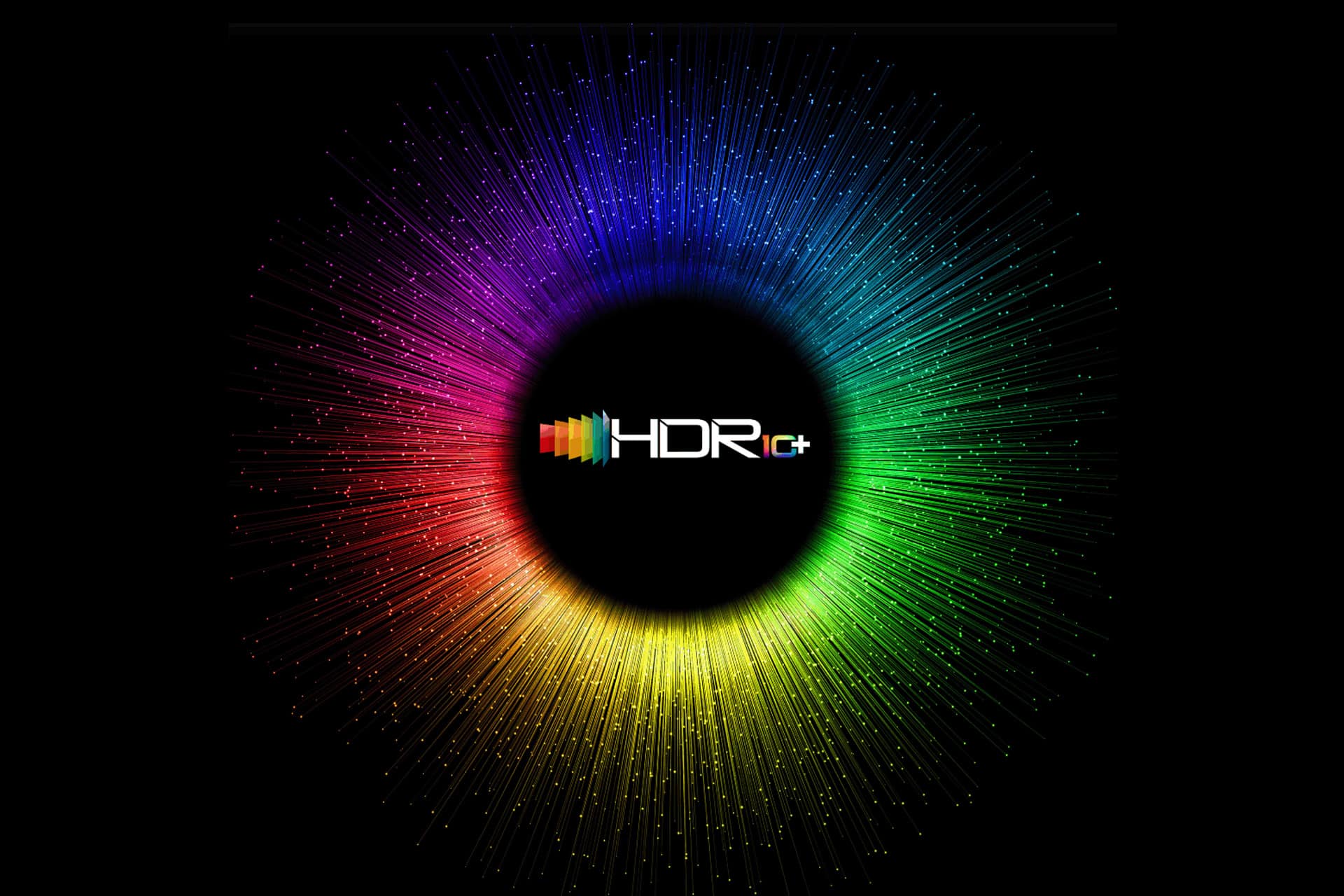 Colorful radial burst with the "HDR10+" logo and SMPTE 2094-50 standard at the center, surrounded by vibrant rays in a gradient spectrum of red, purple, blue, green, and yellow on a black background.