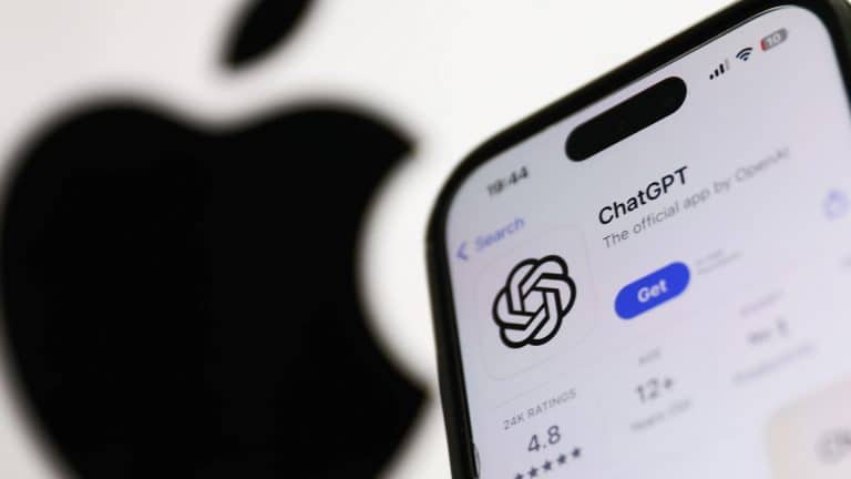 A smartphone displays the OpenAI ChatGPT app page in the App Store, showing its logo and rating, with a large, blurred Apple logo in the background, highlighting the integration of Apple AI technology.