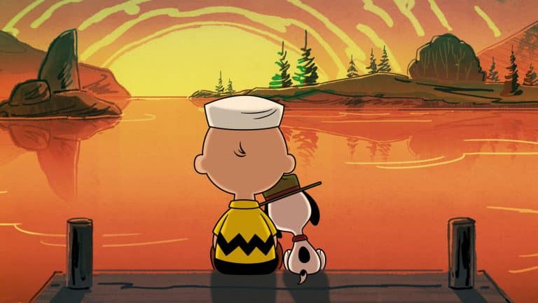 A Peanuts-style cartoon boy and his dog sit on a dock, watching a glowing sunset over a calm lake. The boy wears a zigzag shirt and sailor hat, just like in Peanuts Apple TV specials, while the dog rests its head on his shoulder.