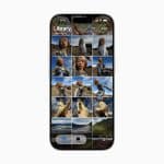 A smartphone screen showcases the iOS 26 Photos layout in a gallery app, featuring several images of a woman outdoors in a shiny silver outfit, set against mountains and fields.