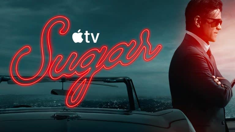 A man in a suit and sunglasses leans on a convertible car at dusk. The word "Sugar" glows in neon, with the Apple TV+ logo and hints of Sugar season 2 as the city skyline shines behind him.
