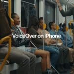 People sit and stand inside a subway car, some holding onto poles. "VoiceOver on iPhone" is displayed in large text at the center, highlighting the accessibility feature for visually impaired commuters.