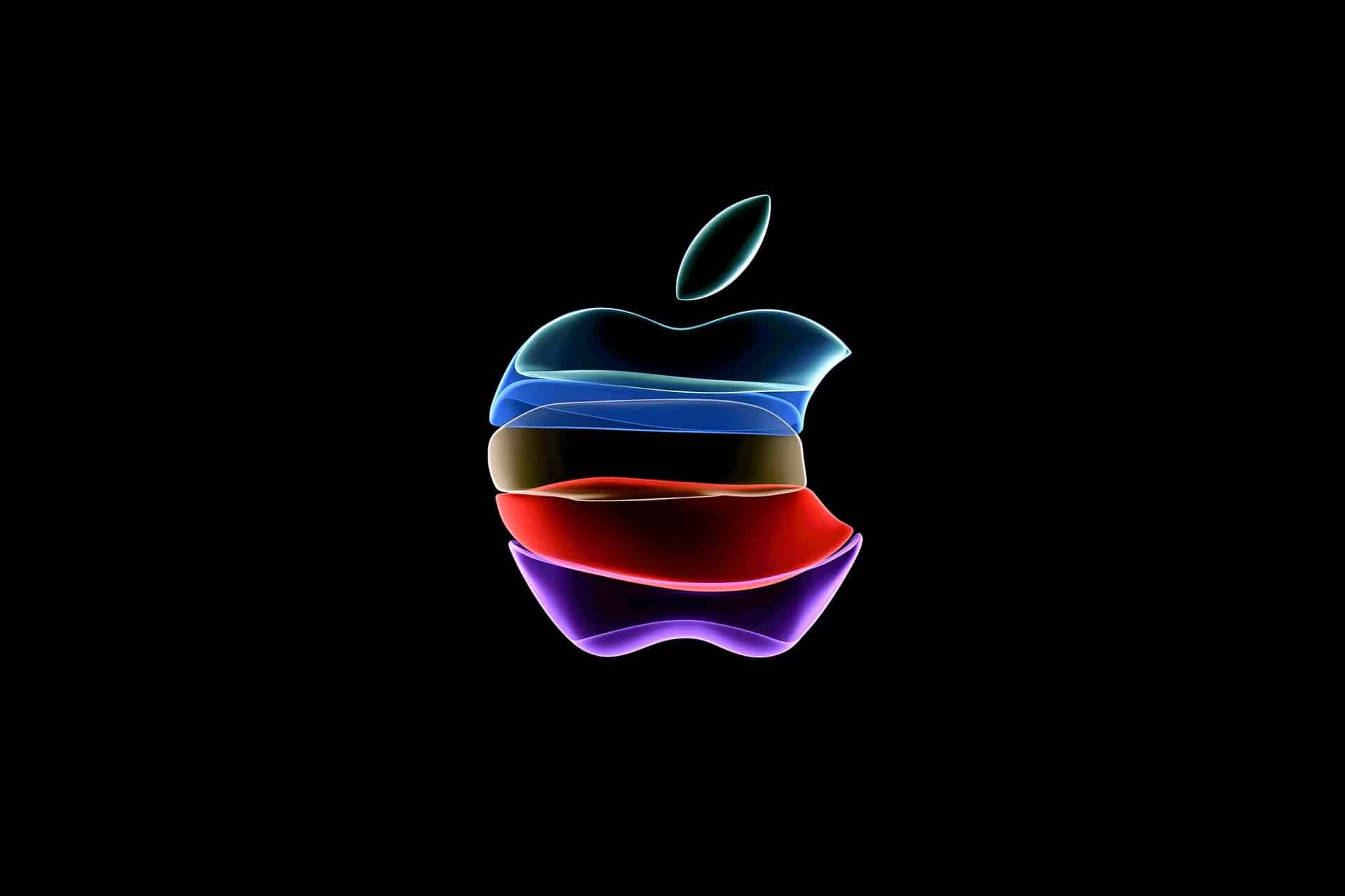 A glowing Apple logo, symbolizing Apple Innovation, features layered neon colors—blue, light blue, red, purple, and yellow—on a solid black background.