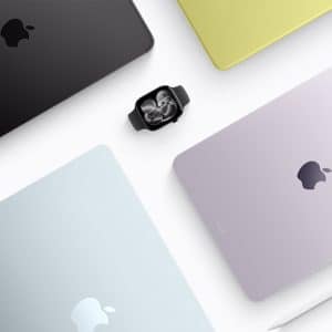 A flat lay of Apple devices in various pastel colors, including iPads, a MacBook, and Apple Watch with earbuds in the center—perfect for an Apple Back to School setup—all arranged with an Apple Pencil on a white surface.